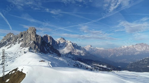 Wide epic winter landscape in the Alps. Aerial of dolomites on Passo Giau in 4K