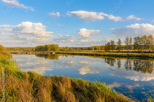 On the bank of river. Summer landscape. Ural, Russia