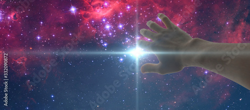 Fototapeta Naklejka Na Ścianę i Meble -  a human hand cover the light stroke frome the night star sky. elements of this image furnished by nasa
