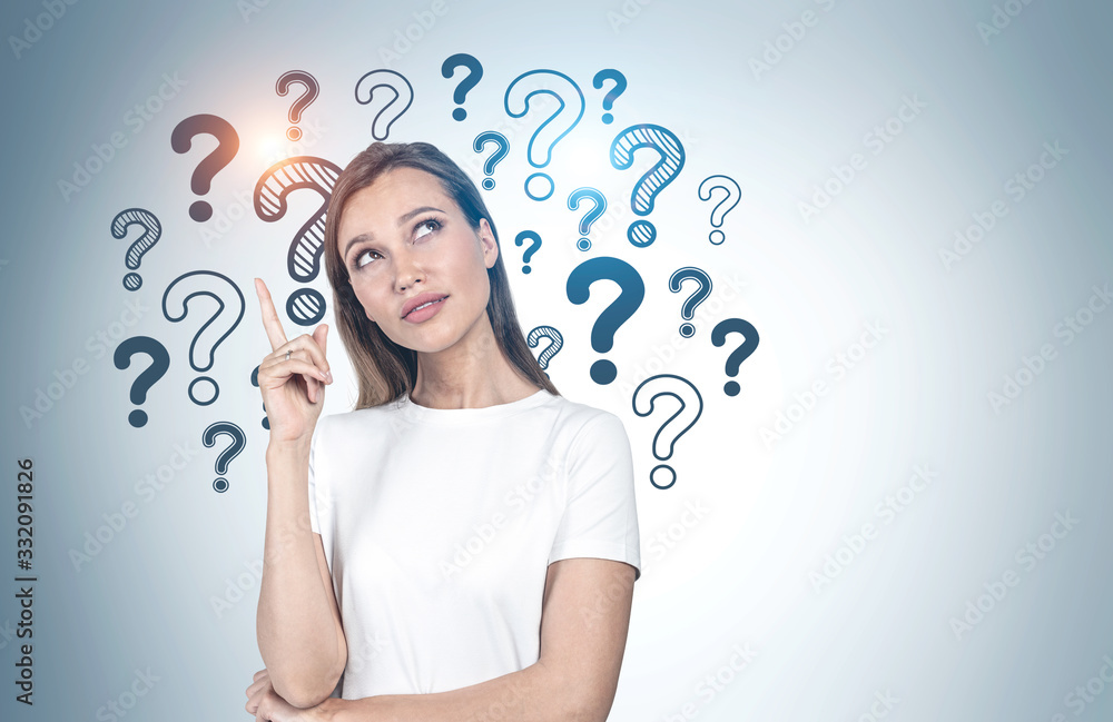 Pensive college girl, question marks