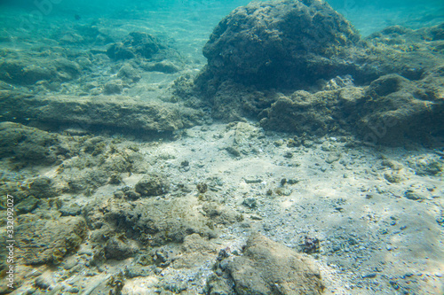 Ocean seabed with stones and sand.