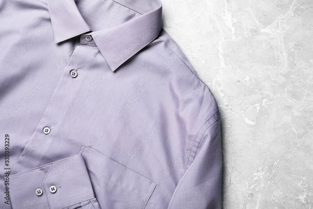Stylish shirt on grey marble table, top view. Dry-cleaning service Stylish shirt on grey marble table, top view. Dry-cleaning service