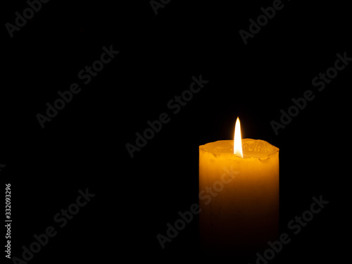Coarse candle lit right with black background