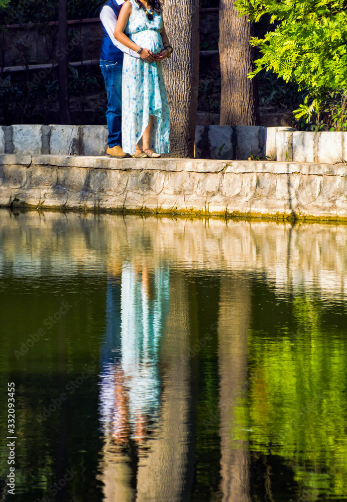 Maternity shoot pose for new born baby in Lodhi Road in Delhi