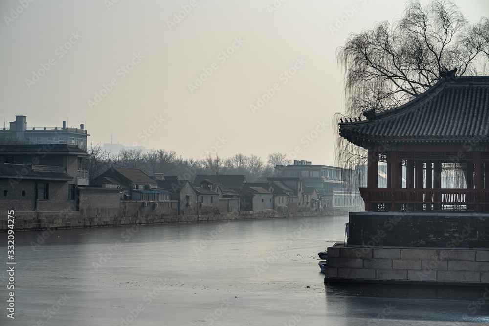 Pavilion by the moat, water became frozen at the Forbidden City in winter, Beijing, China.
