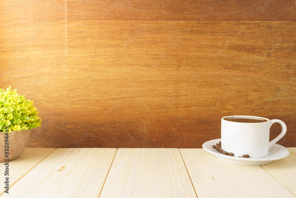 coffee cup with beans and office supplies on wooden desk against wood background. copy space for your text coffee cup with beans and office supplies on wooden desk against wood background. copy space for your text