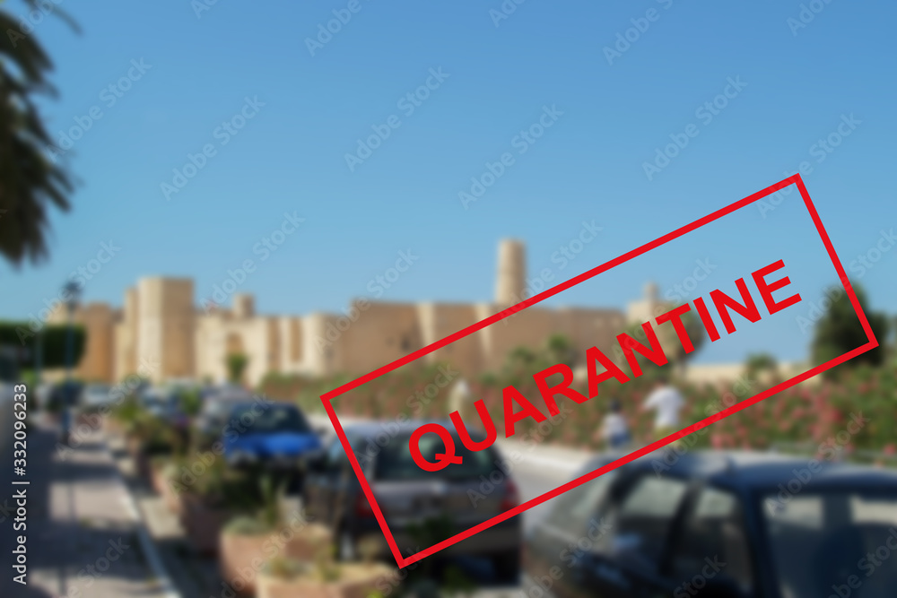 Obraz premium Text of the quarantine against the background of urban architecture in Tunisia