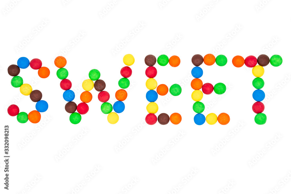 The inscription sweetness is laid out with colored candies The inscription sweetness is laid out with colored candies