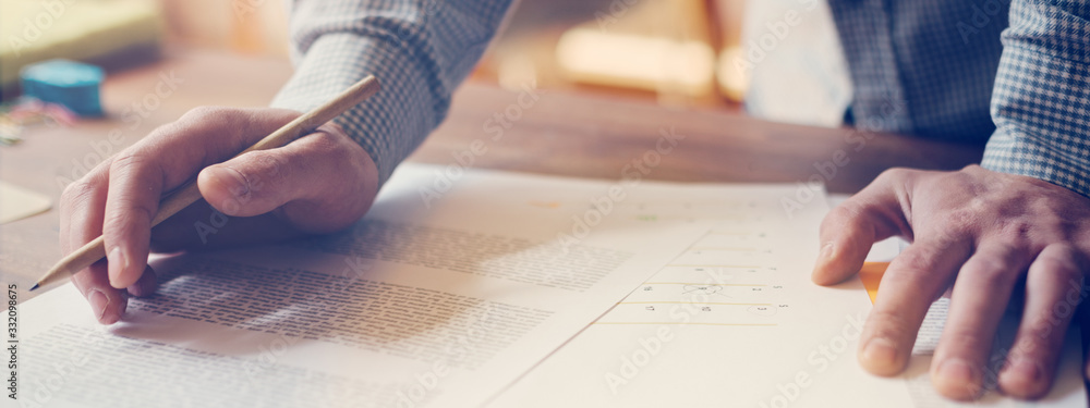 Paperwork on the table. New business plan analyse. Man working in open space. Wide screen. Panoramic Paperwork on the table. New business plan analyse. Man working in open space. Wide screen. Panoramic