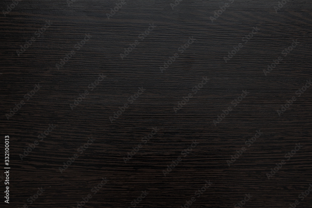 The texture of the table top is made of dark wood The texture of the table top is made of dark wood