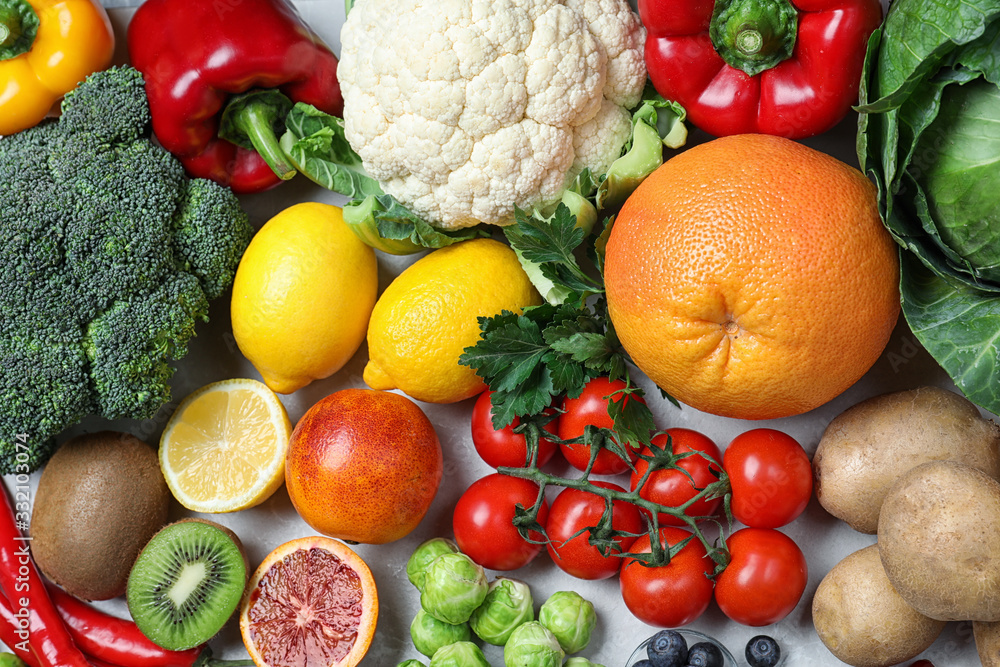 Different products rich in vitamin C on table, flat lay Different products rich in vitamin C on table, flat lay