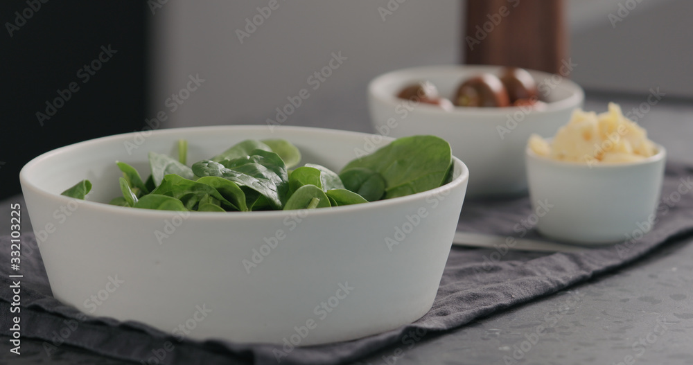 d fresh spinach leaves in white bowl d fresh spinach leaves in white bowl