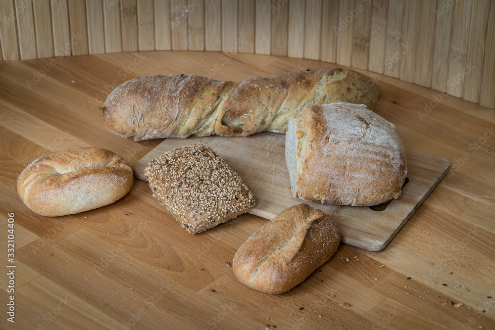 Fresh Bread On Wooden Chopping Board