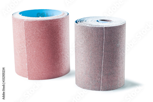 two big rools of sandpaper isolated woodworking tools