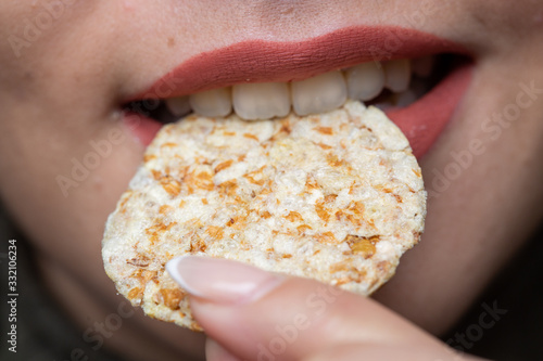 woman eating spelled chips