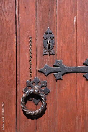 Old Wooden Door With Rounded Iron Handles. Oak colors. © tonklafoto