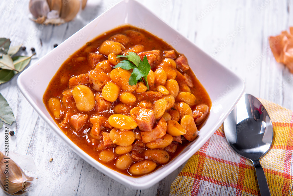 Baked beans in tomato sauce with chopped sausage Baked beans in tomato sauce with chopped sausage