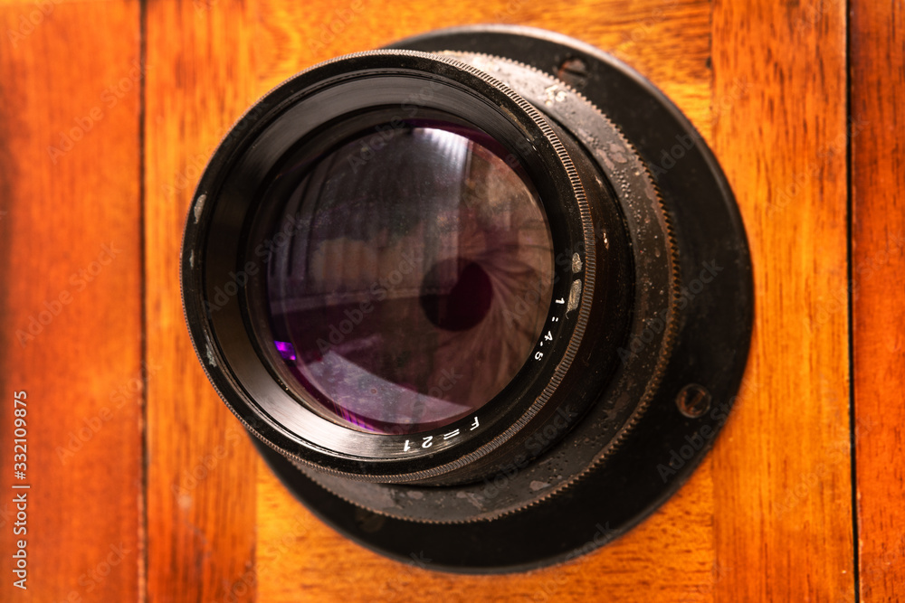 lens on an old wooden camera