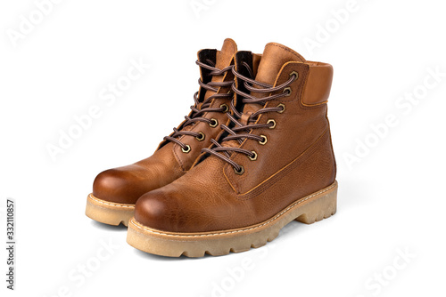 Red winter leather boots isolated on white background.