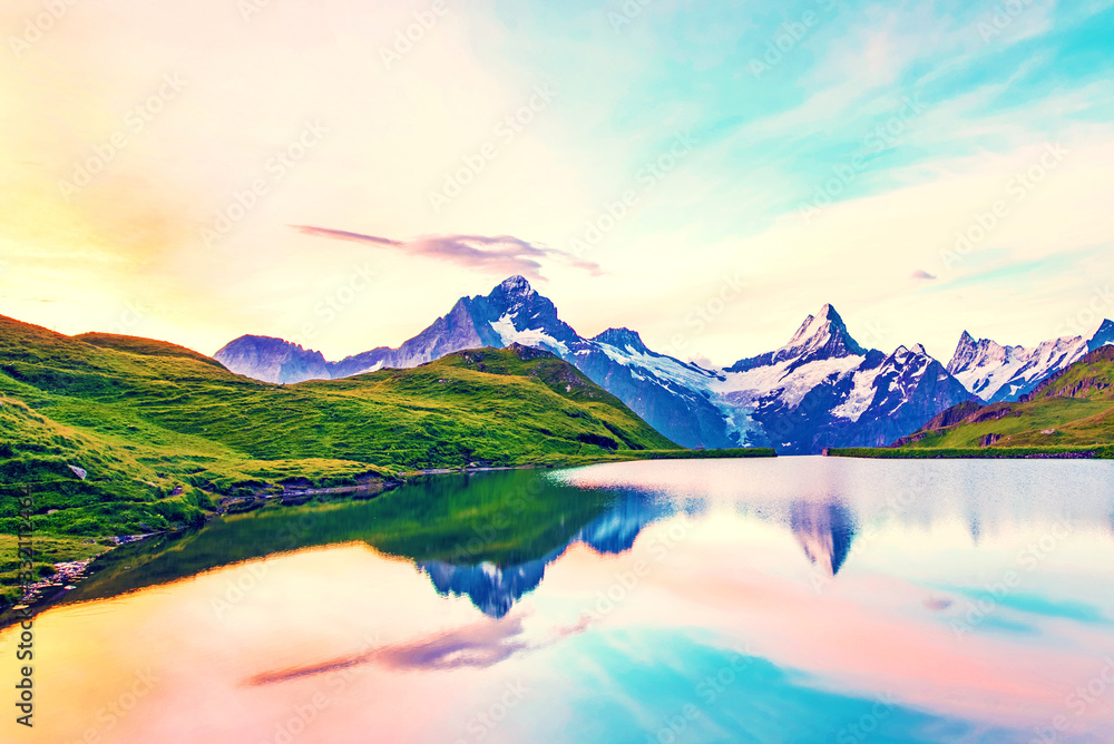 Fantastic landscape at sunrise over the lake in the Swiss Alps, Europe. Wetterhorn, Schreckhorn, Finsteraarhorn et Bachsee. ( relaxation, harmony, anti-stress - concept).