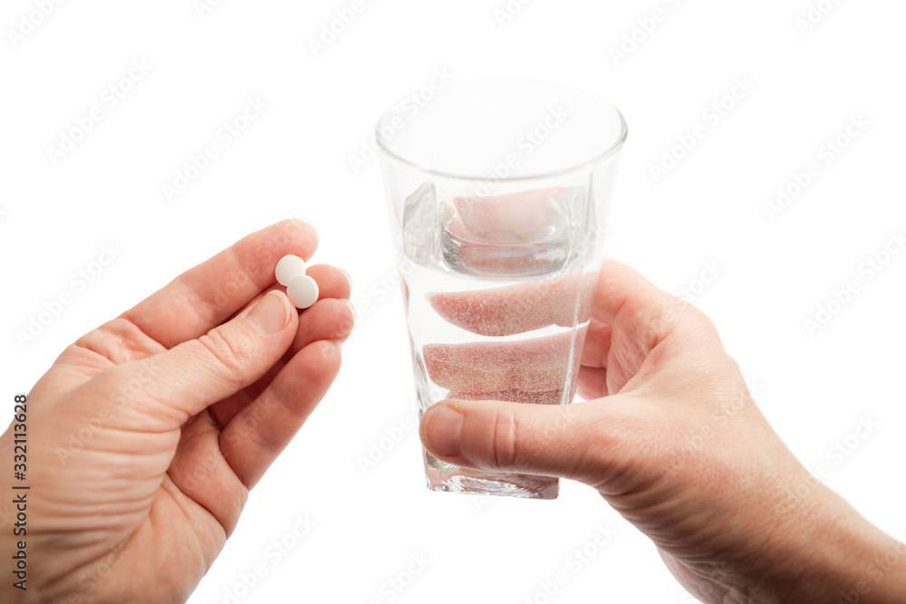 Water and pills in hands Water and pills in hands
