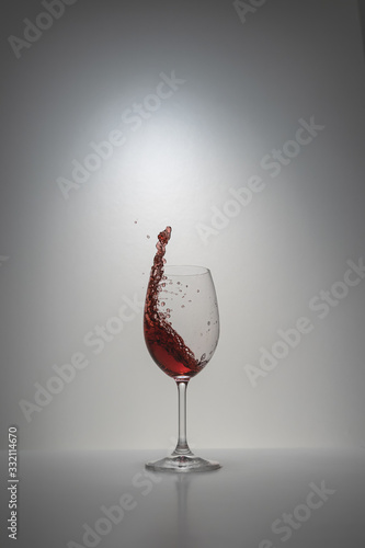 red wine splash in glass photo