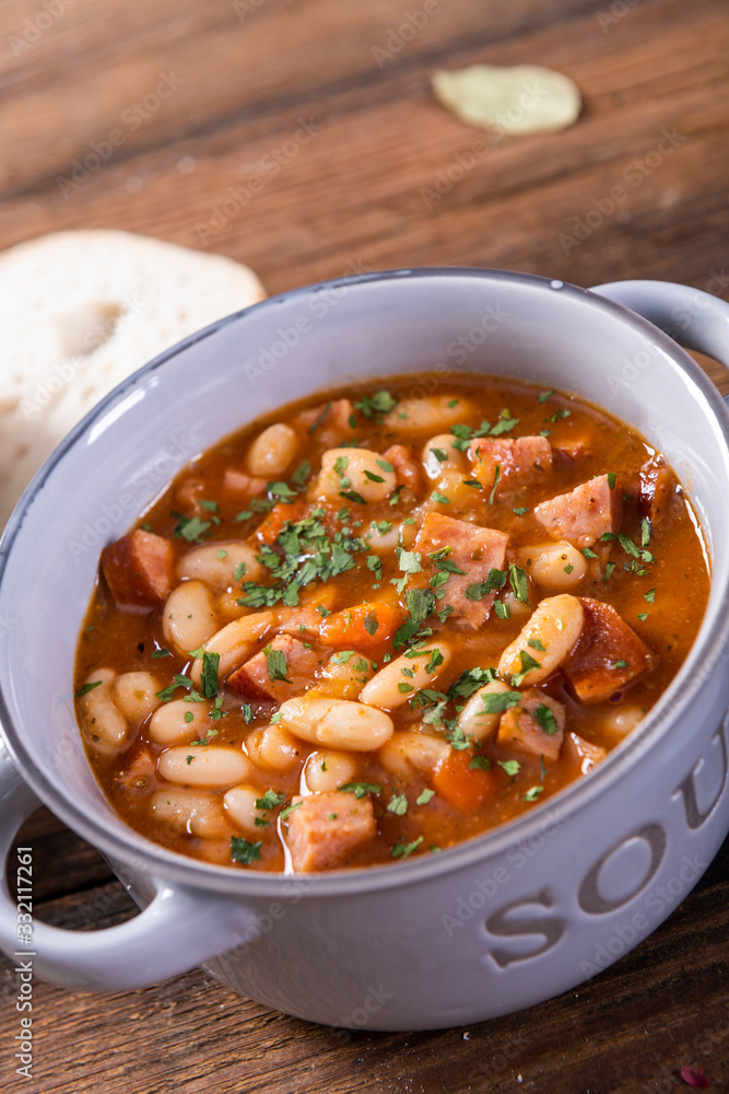 Baked beans in tomato sauce with chopped sausage Baked beans in tomato sauce with chopped sausage