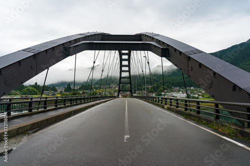Fototapeta Naklejka Na Ścianę i Meble -  Bridge steel frame with asphalt road. Bridge in Japanese countryside