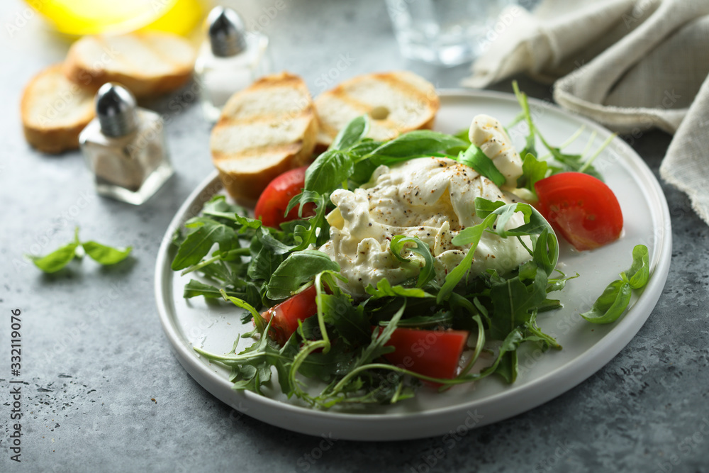 Homemade burrata cheese salad with tomatoes Homemade burrata cheese salad with tomatoes
