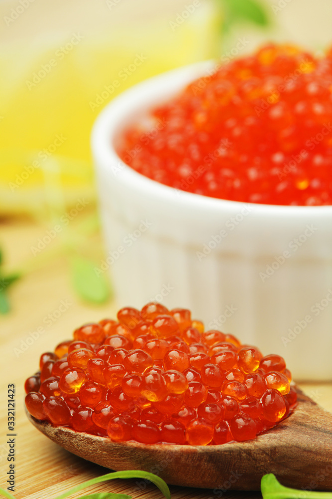 A small ceramic bowl with red caviar A small ceramic bowl with red caviar