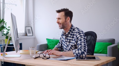 Freelancer working on computer from home office