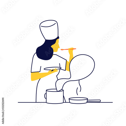 Joven cocinera trabajando. Chef huele la comida que está preparando.