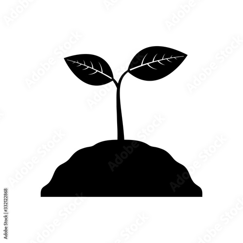 Sign plants and leaves. A sprout sprouts from the ground on which there are leaves