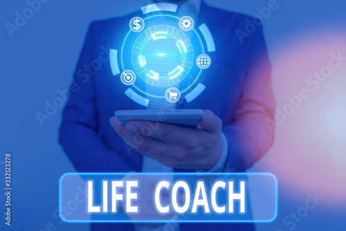 Writing note showing Life Coach. Business concept for someone who helps identify your goals and plan to achieve them photo