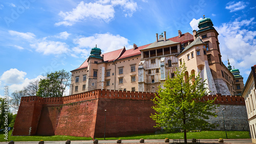View on the walls of Wawel royal castle with Basilica of saint Stanislaus and Wenceslaus during the sunny morning in Krakow