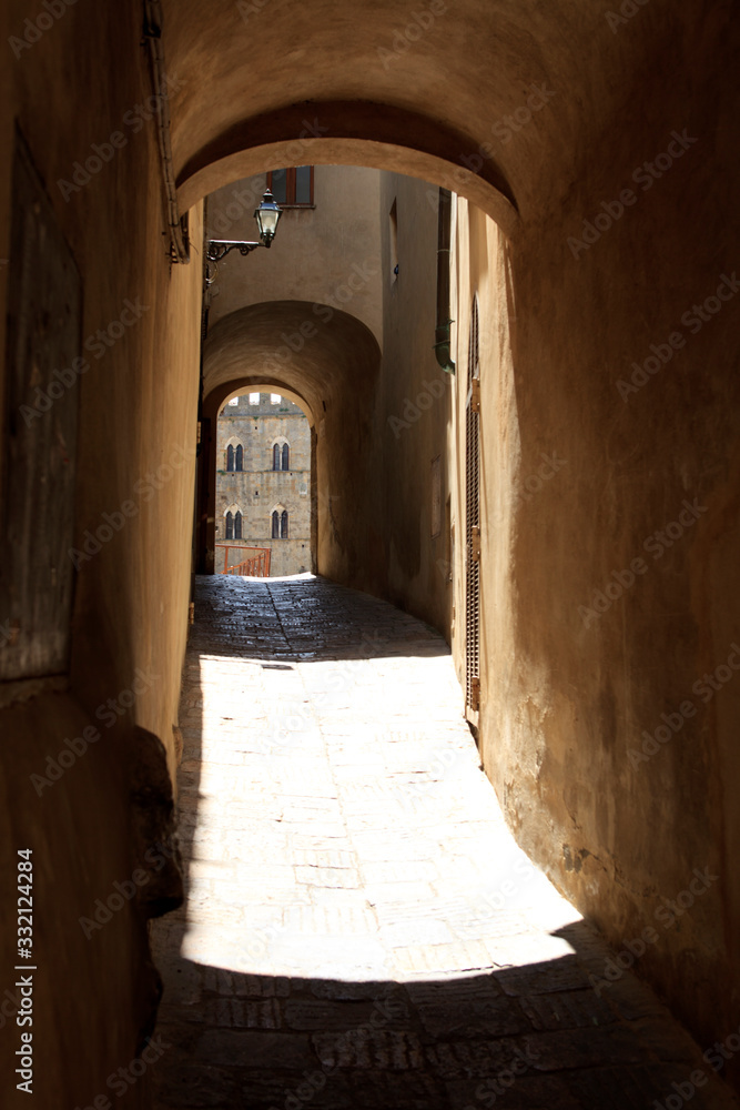 Volterra (SI), Italy - April 25, 2017: A typical road in Volterra town, Tuscany, Italy