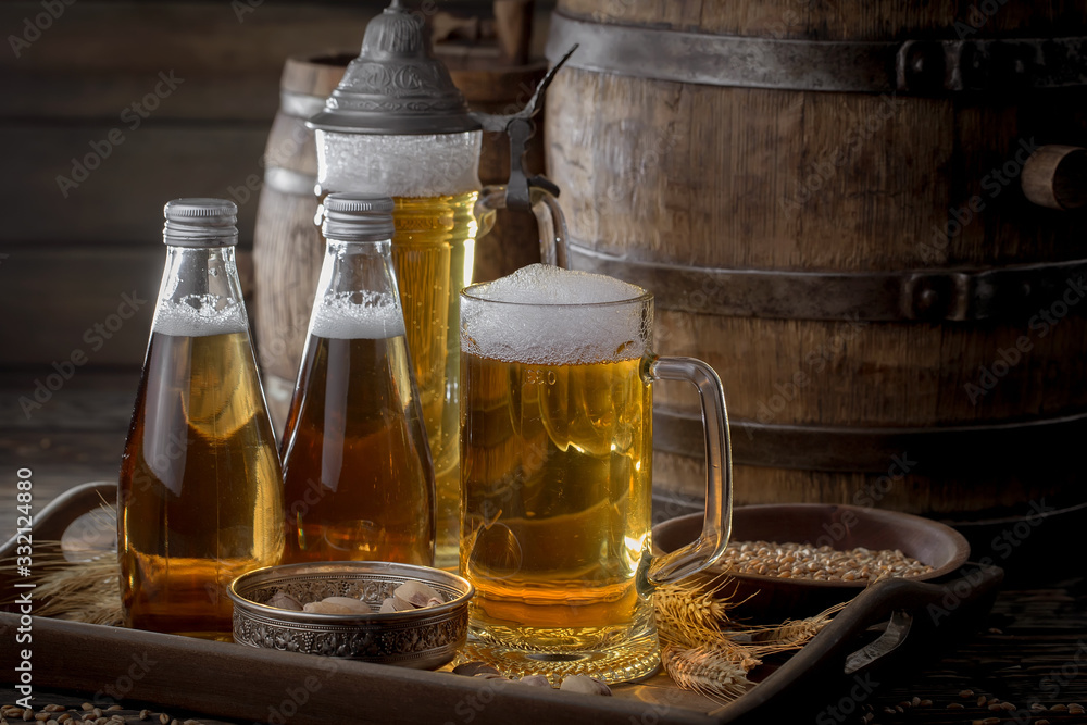 Light beer in a glass, on an old background. Light beer in a glass, on an old background.