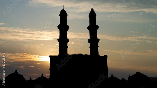 Jami Masjid or Jama Mosque: Time Lapse at Sunrise with Colorful Clouds , Champaner Pavagadh Archaeological Park, Gujarat, India photo