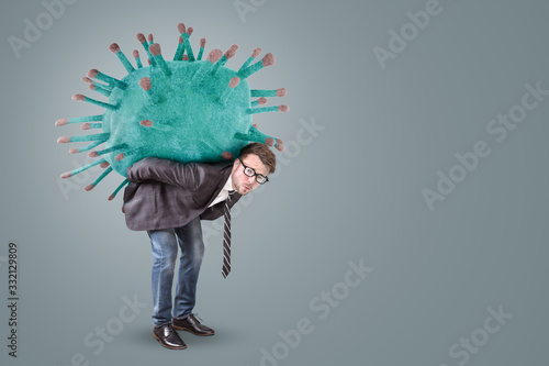 Businessman carrying an oversized Virus photo