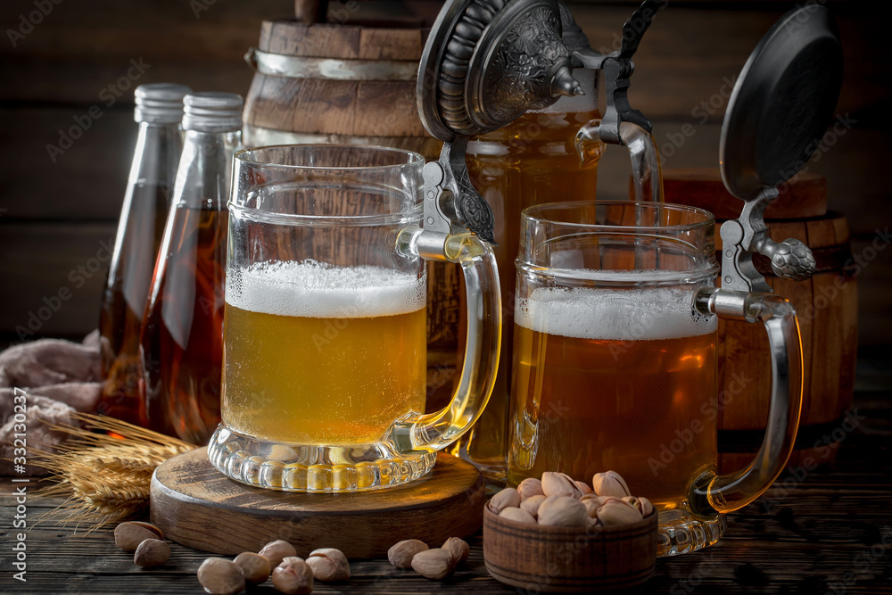 Light beer in a glass on a table in composition with accessories on an old background Light beer in a glass on a table in composition with accessories on an old background
