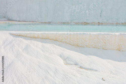 Details of white carbonate mineral rocks made by water flow at Pamukkale near archelological site Hierapolis  Denizli  Turkey