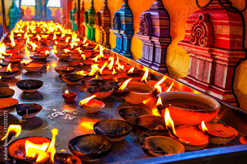 Canles fire in hindu temple near the Batu Caves, Malaysia photo