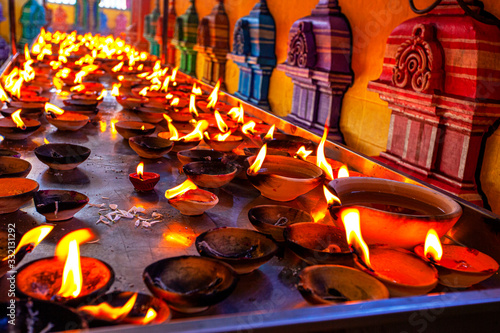 Canles fire in hindu temple near the Batu Caves, Malaysia photo