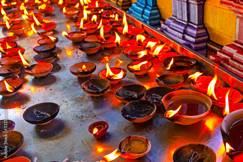 Canles fire in hindu temple near the Batu Caves, Malaysia photo