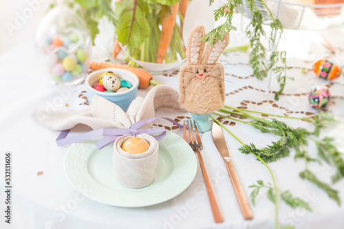 Polish Easter table close up detail. Easter food in Poland. Hand made bunny egg cosy. photo