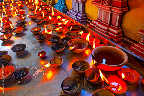 Canles fire in hindu temple near the Batu Caves, Malaysia photo