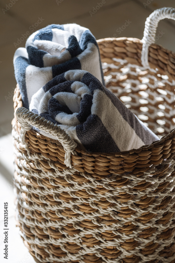 Obraz premium Two dry, clean large towels in wicker basket