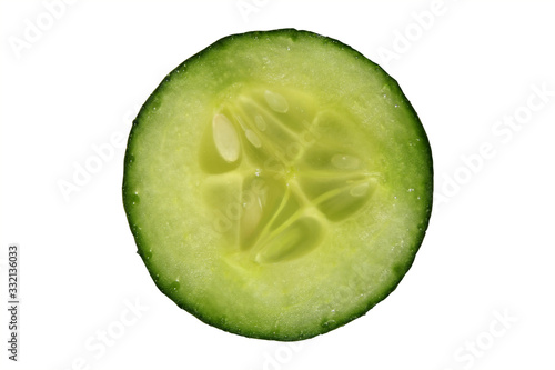 one slice of green fresh cucumber vegetable, , concept of healthy eating, veganism