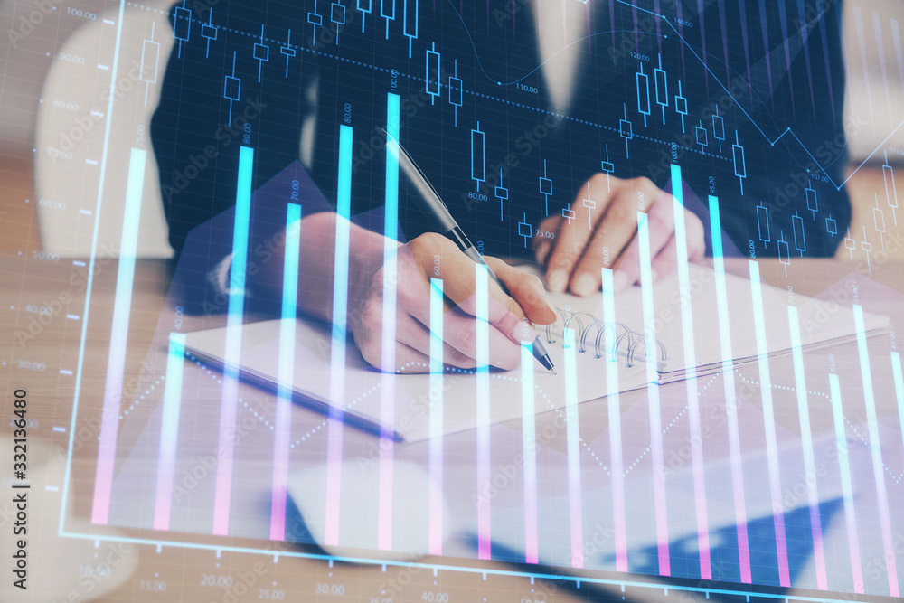 Forex graph on hand taking notes background. Concept of research. Multi exposure Forex graph on hand taking notes background. Concept of research. Multi exposure