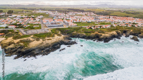 Cliffs in front of Porto Covo village, in Portugal photo